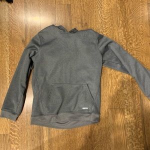 gray sweatshirt with red in the inside of the hood